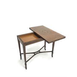 Edwardian walnut and mahogany Sheraton revival card table, rectangular top cross banded and inlaid with scrolling foliage, the central inlay with four urns and trailing leafage, swivel fold over action revealing storage well and baize lined interior, husk inlaid square tapering supports with spade feet, shaped and pierced x-framed stretcher, brass castors