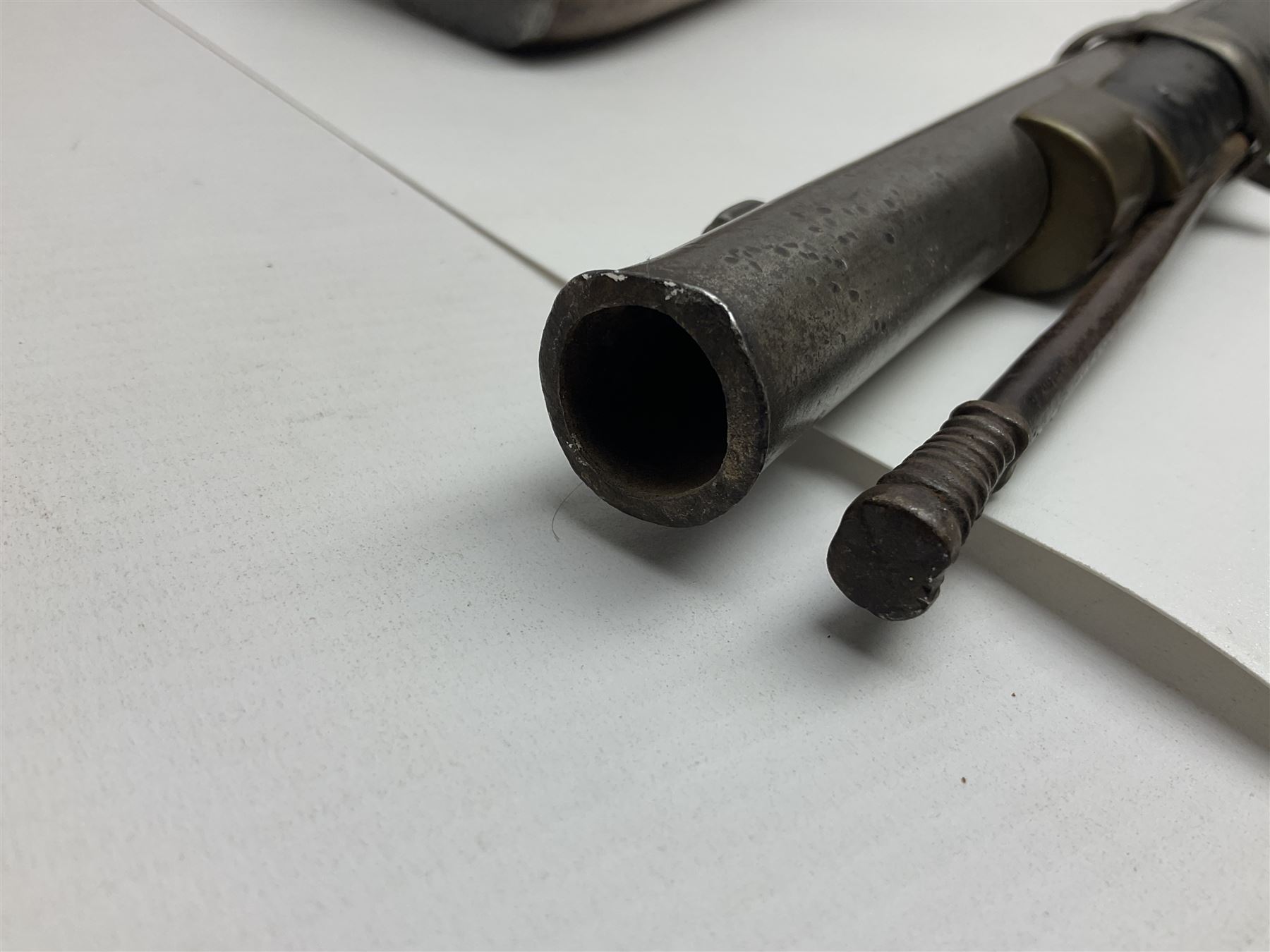 19th century Indian .577 Enfield muzzle loading rifle, proofed for 26-bore, the 98.5cm barrel with three barrel bands and later ram rod L140cm overall; 19th century Belgian side-by-side double barrel percussion shotgun, approximately 20-bore, with 74cm barrels and studded walnut stock, lock plate marked 'Liege 1868' and 'V. Gulikers-Maquinay' L117cm overall; and another side-by-side double barrel shotgun by Smythe with underlever opening (3)