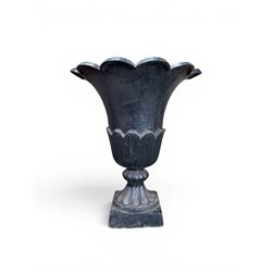 Pair of Victorian large scale cast iron garden urns, flared petal shaped rim with tapering waist, gadrooned base on square plinth, finished in black paint