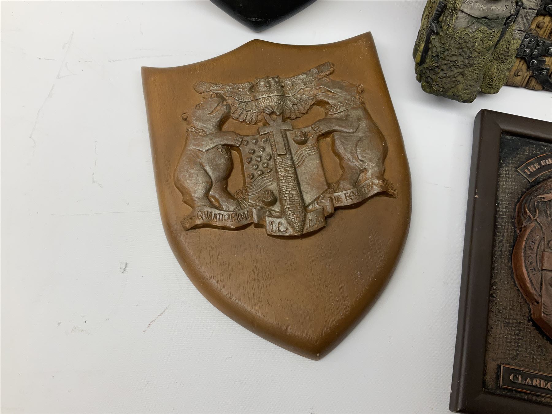 Terry Pratchett Discworld plaques, designed by Clarecraft, comprising 'the First Discworld Event Clarecraft August 95', the collectors guild joining shield, the fools guild DW99C, the seamstresses guild DW98C, the musicians guild DW00C together with 'Door of the mended drum' wall hanging DW17. 