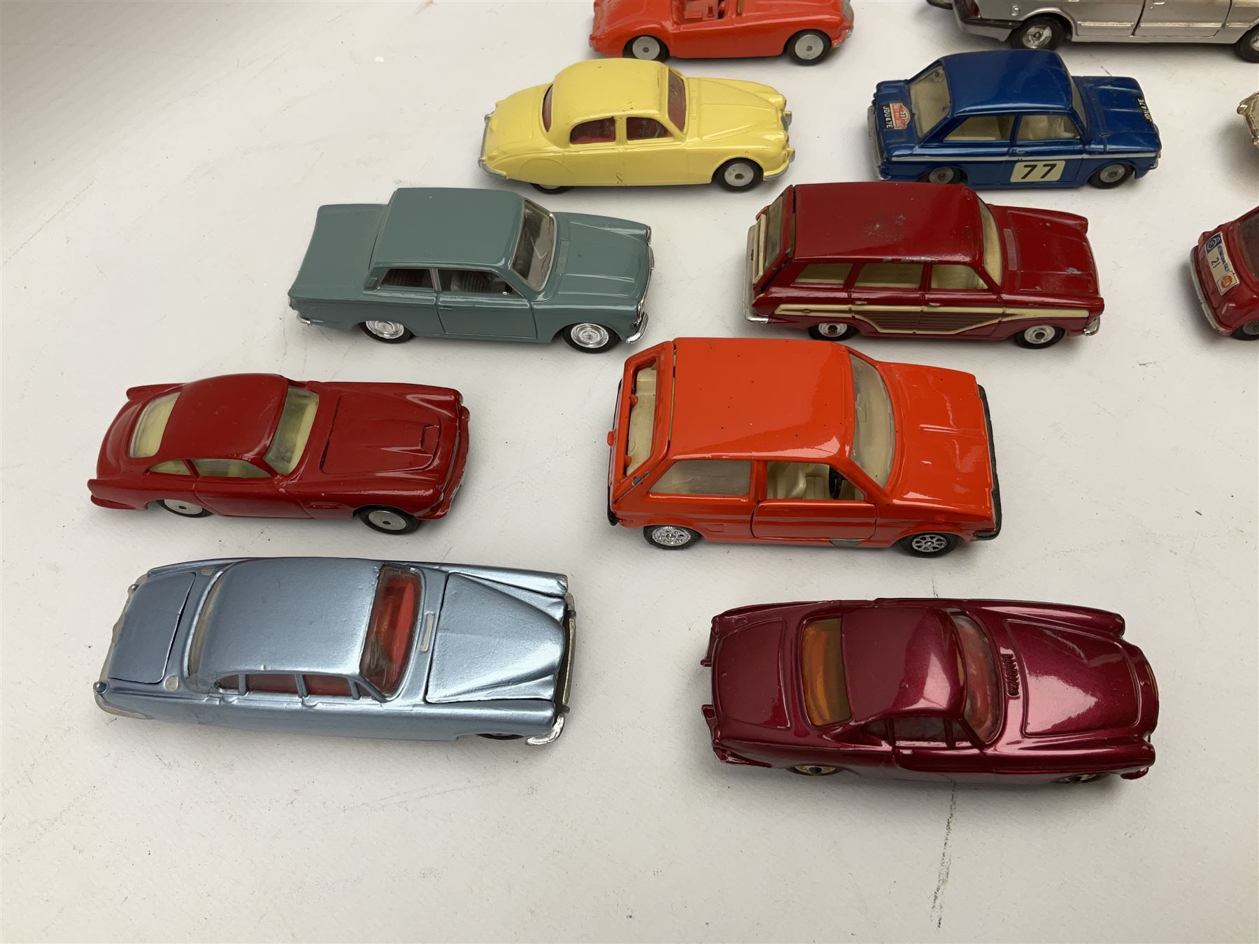 Corgi - thirty unboxed and playworn/repainted die-cast cars including Triumph Herald Coupe, BMC Mini-Cooper 'S', Porsche Carrera, two 'E' Type Jaguars, Rover 2000TC, three Morris Minors, two Aston Martin DB4, two Volvo P1800, MGA, Fiat 2100, Jaguar 2.4 Litre, Jaguar Mark X Saloon etc (30)