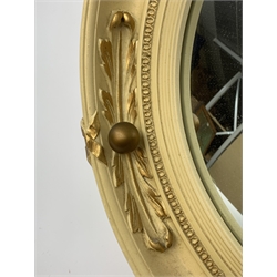 A vintage Atsonea convex mirror, of circular form, the cream frame with gilt detail, D41.5cm.