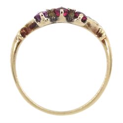 Victorian 9ct rose gold red paste and seed pearl ring, oval paste stone within a scrolling border of seed pearls, surmounted with round cut red paste stones