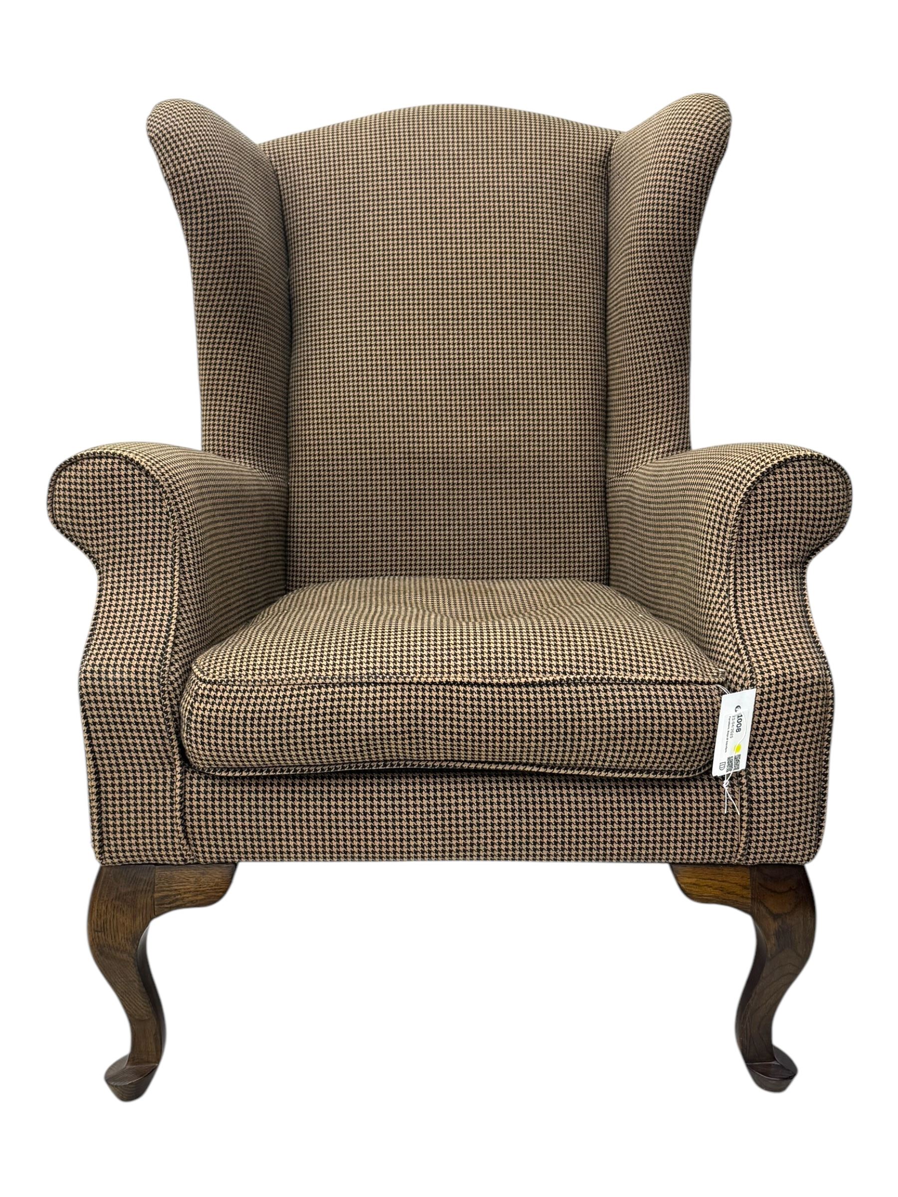 Hardwood-framed wingback armchair, upholstered in dog tooth pattern fabric, on cabriole supports 