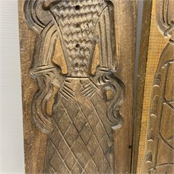 Six 20th century hardwood Dutch folk art Speculaasplank or biscuit moulds, typically carved with figures in traditional dress, largest H101cm