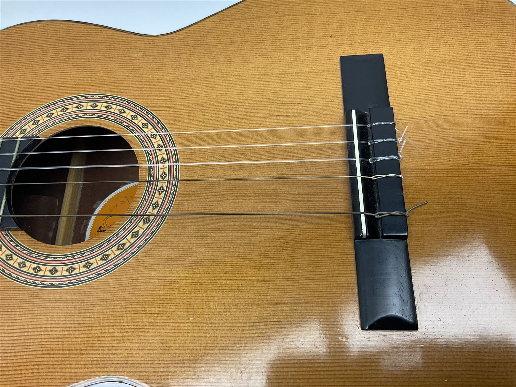 Spanish BM acoustic guitar with mahogany back and sides and spruce top L101cm; in cello carrying case; Roland foot pedal and two Yamaha foot pedals; tin D# organ pipe; folding music stand etc