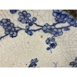 20th century Chinese blue and white crackle glaze charger, decorated with peonies, prunus blossom, and rockwork, within simulated bronze border, with character mark verso, D34cm