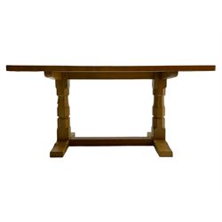 Mouseman - oak dining table, adzed rectangular top on twin octagonal pillar supports, sledge feet united by floor stretcher, by the workshop of Robert Thompson, Kilburn 