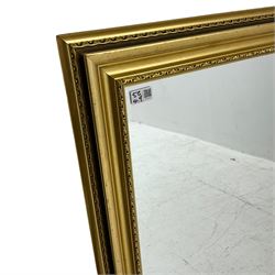 Narrow rectangular wall mirror in ornate gilt frame (42cm x 133cm), and two other wall mirrors