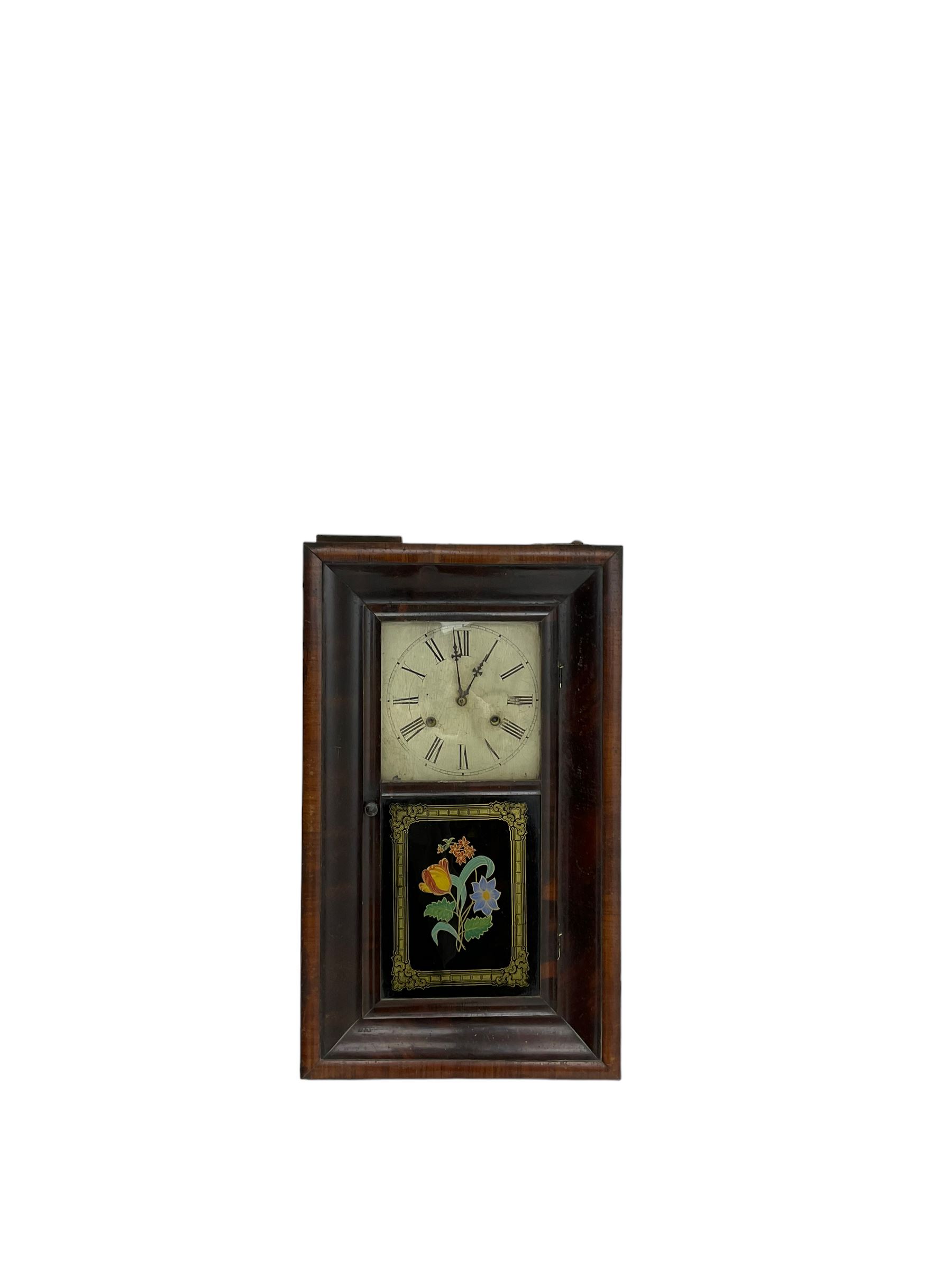 Jerome & Co - American late 19th century 30 hr weight driven mahogany wall clock, with deep ogee moulding and glazed door with a painted tablet,
Painted dial with Roman numerals and Maltese cross hands, twin train movement, striking the hours on a coiled gong. With weights and pendulum.
