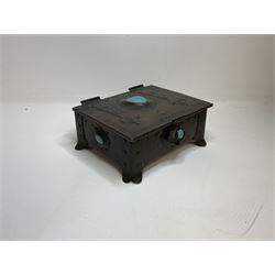 Arts and Crafts copper box, the lid decorated with stylised riveted hinges and inset with Ruskin type ceramic turquoise heart-shaped cabochon, the mount etched M.B 1913, and further cabochon roundel to each side panel, including one inset to the clasp acting as the knob to the locking mechanism, marked RS Douglas 1913 beneath, W16.5cm H7cm D15cm