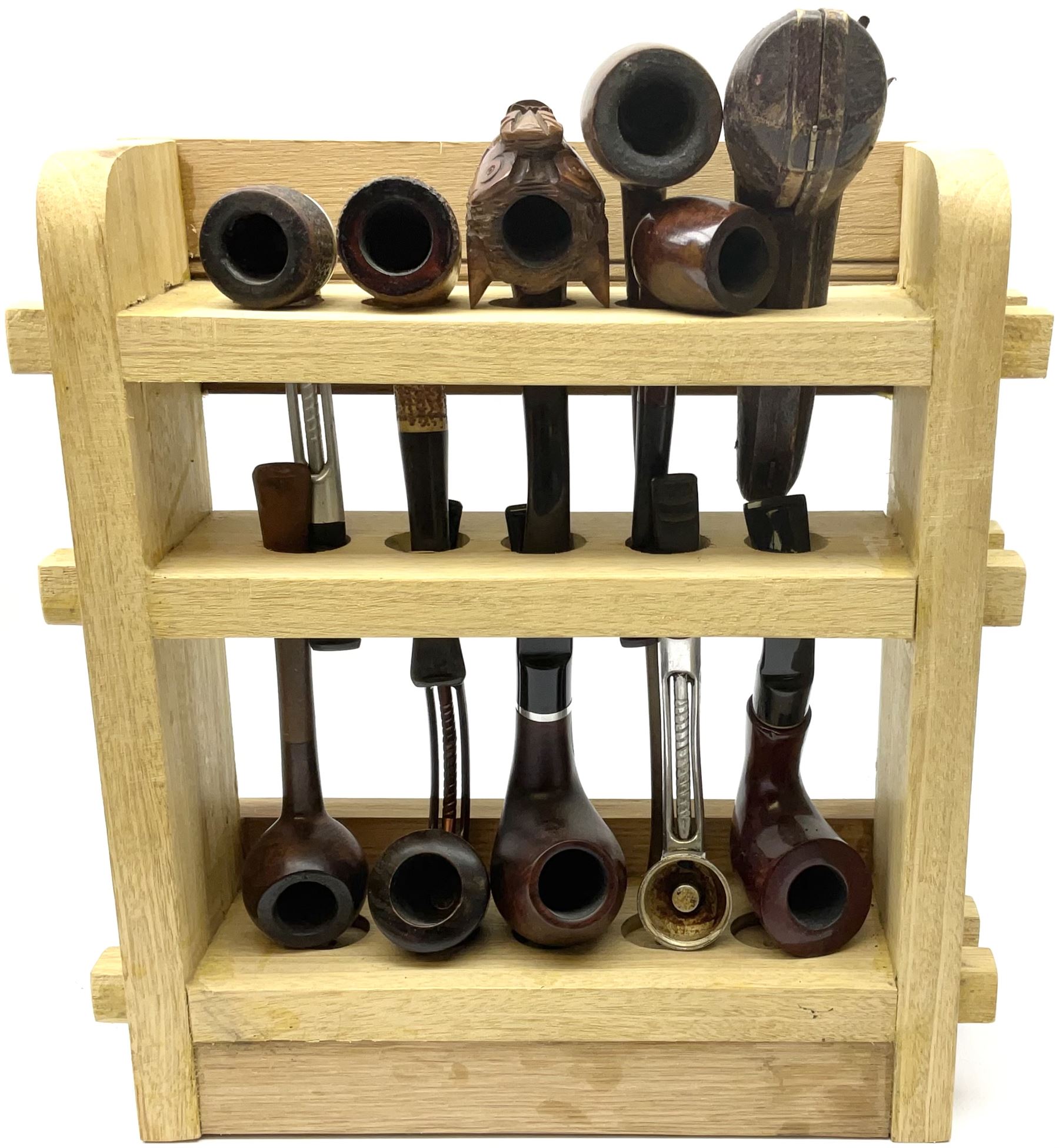 Pipes and two tiered wooden rack together with eleven pipers, including briar pipe carved as a wolf, Sea Dog straight pipe, John Brumfit pipe, meerschaum pipe ect, pipe rack H29.5cm