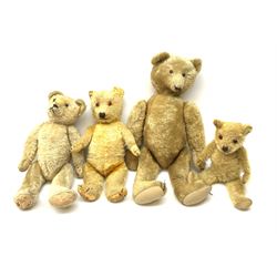 Four teddy bears 1930s-50s including large, possibly American, bear with swivel jointed head, boot button eyes, traces of horizontal nose stitching and mouth  and jointed limbs with felt paw pads H24