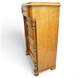 Tall late 19th century walnut chest, stepped and moulded top over six drawers, ornate cast gilt metal handles, enclosed by turned and fluted upright columns, on turned front feet 