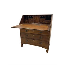 Georgian oak bureau, fall front enclosing fitted interior, fitted with four long graduating drawers, on bracket feet