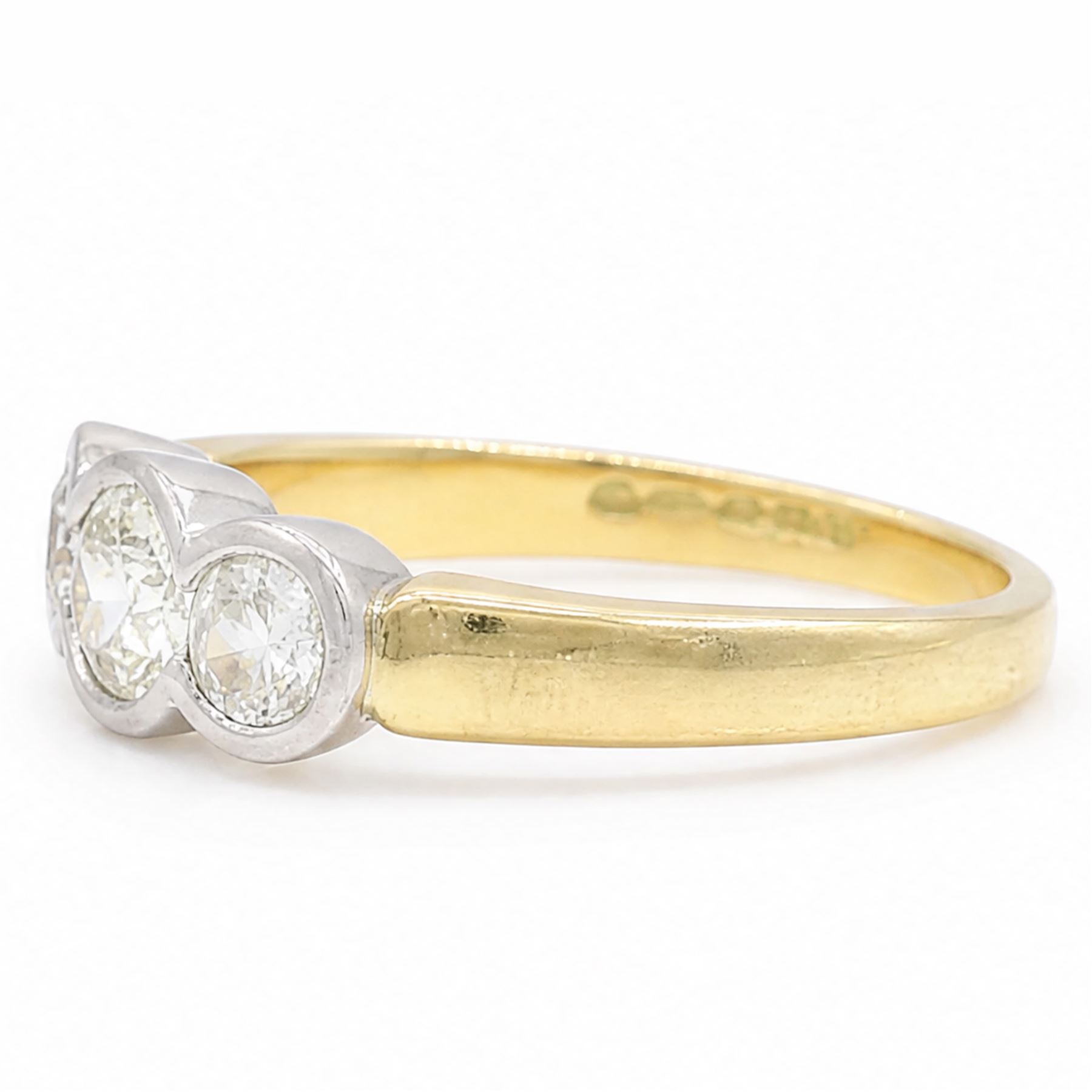 18ct gold gold and platinum diamond ring, bezel set with three old cut diamonds, Birmingham assay mark, total diamond weight approx 0.75 carat