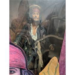 Collection of Disney and similar figures and memorabilia, including Pirates of the Caribbean Capt Jack Sparrow talking figure and NECA toys Jack Sparrow Head Knocker, three Disney showcase figures, Kermit the Frog framed film cell and Tomb Raider figure