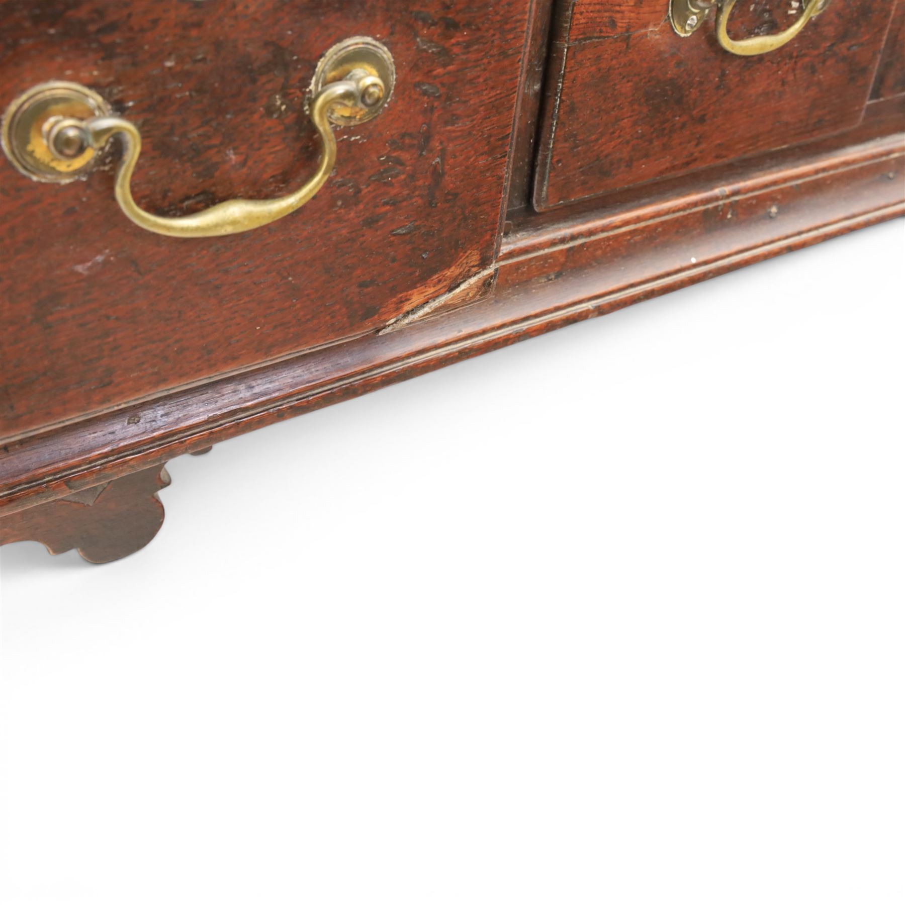 17th century 8’ oak dresser base with moulded front, rectangular top, above four drawers, raised on turned and block support 