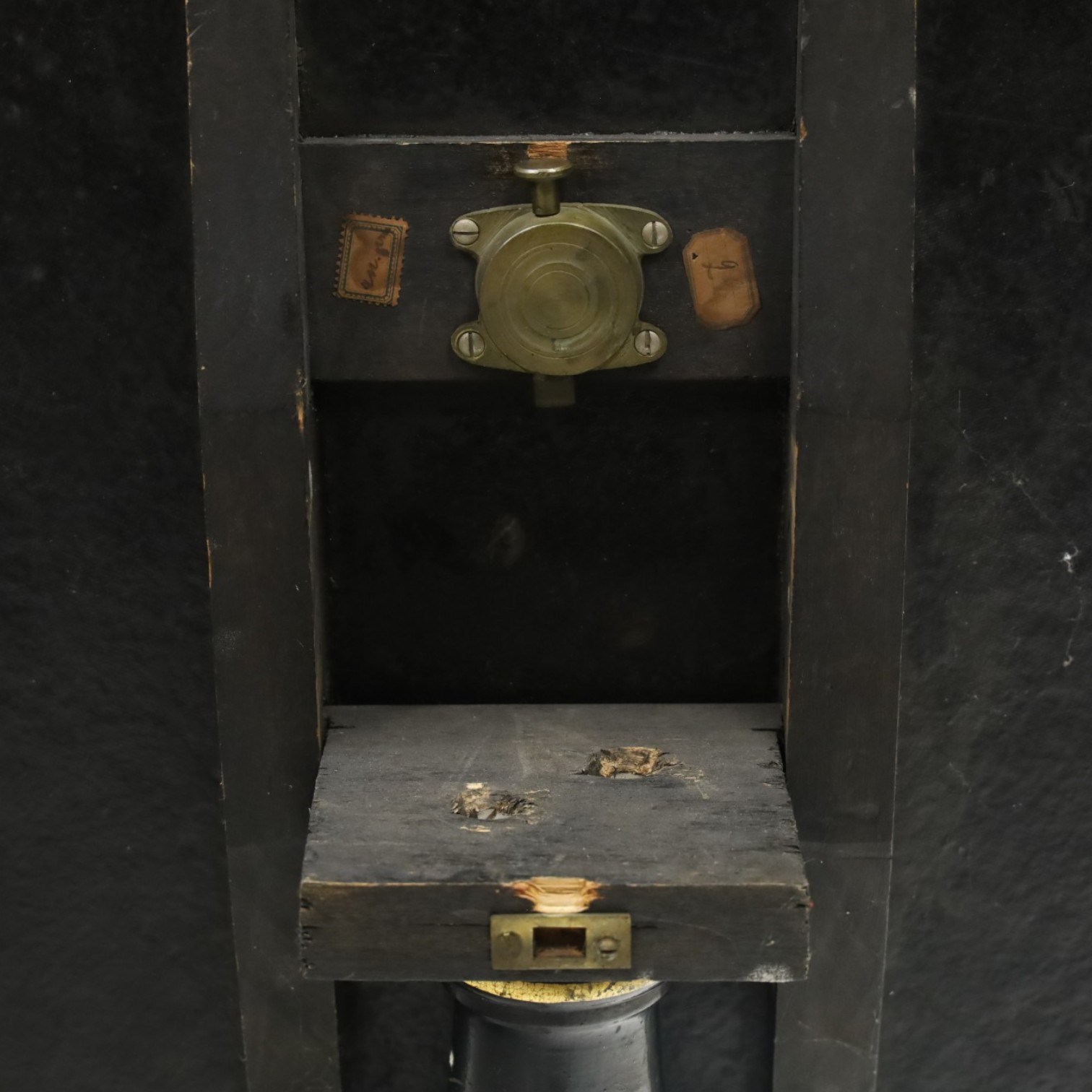 Late Victorian Aesthetic Movement ebonised and parcel-gilt lacquered occasional table, the circular tilt-top decorated in the Anglo-Japanese taste with motifs of fans, birds, insects and flowering branches, raised on a turned pedestal and tripod base shaped splayed supports