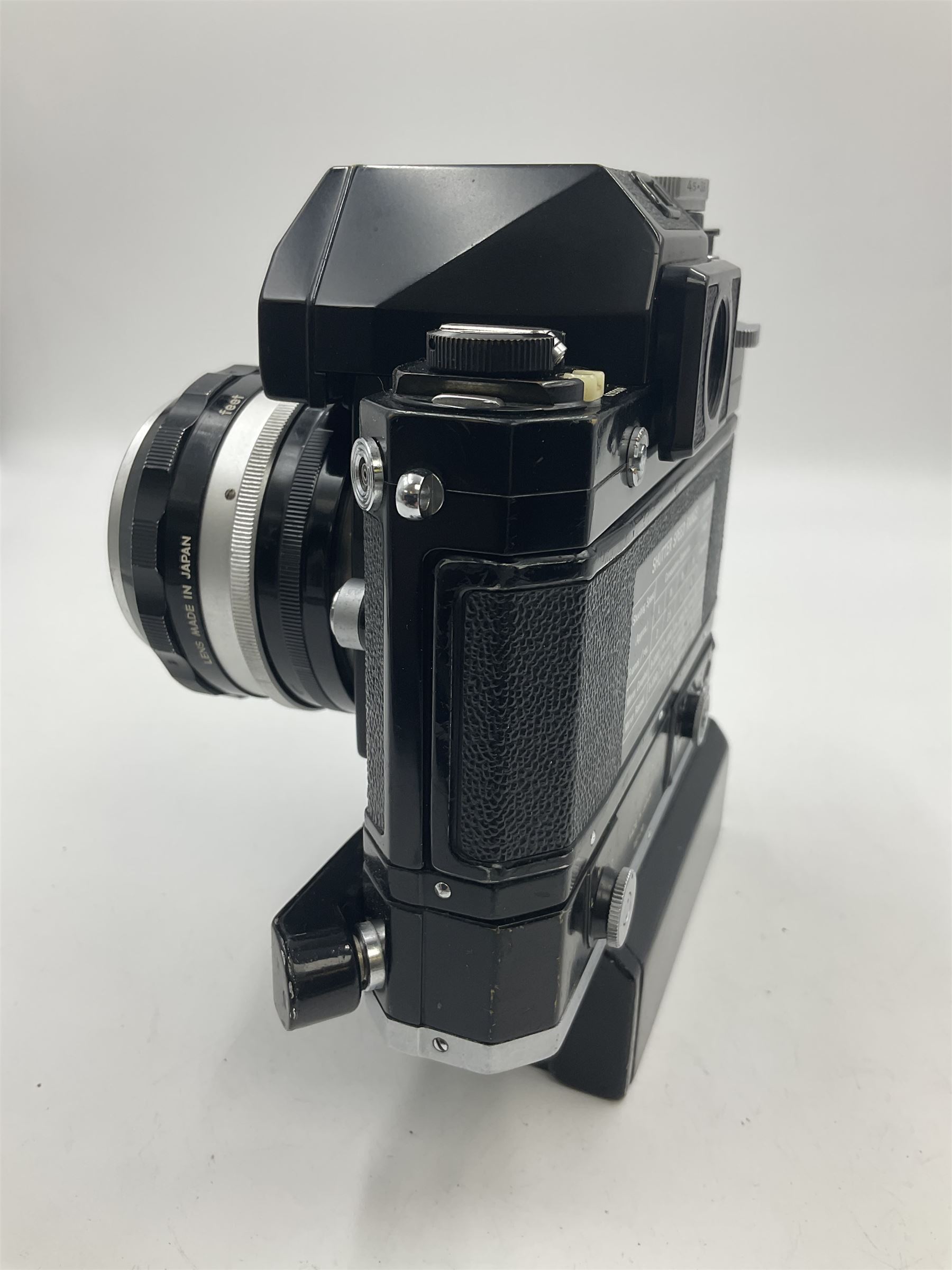 Nikon Photomic TN NKJ camera body, serial no 6728309, circa 1965, with 'Nippon Kogaku NIKKOR-S Auto 1:1.4 f=5.8cm' lens, serial no. 173909, Nikon F36 Motor Drive, serial no.132430 and Nikon cordless battery pack