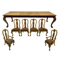 Polished pine extending dining table, on cabriole supports with paw feet, together with set of six dining chairs