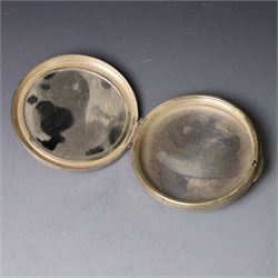 1960s silver compact mirror, of circular form with engine turned and engraved foliate decoration to lid, hallmarked Kigu Ltd, London 1963 and an early 20th century silver cigarette case with engraved monogram to cover, hallmarked A J Pepper & Co, Birmingham 1918