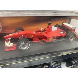 Five Mattel Hot Wheels 1:18 scale die-cast racing cars - Ferrari F1-2000 Michael Schumacher; Ferrari F-2002 Michael Schumacher; Jordan E-110 Heinz-Harald Frentzen; Williams F1 Team FW23Juan Pablo Montoya; and Ferrari F2001 Rubens Barrichello; all boxed (5)
