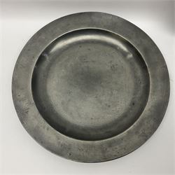 Group of seven 19th century pewter chargers, each of circular form with dished centre, two examples with touch marks verso, each approximately D39cm