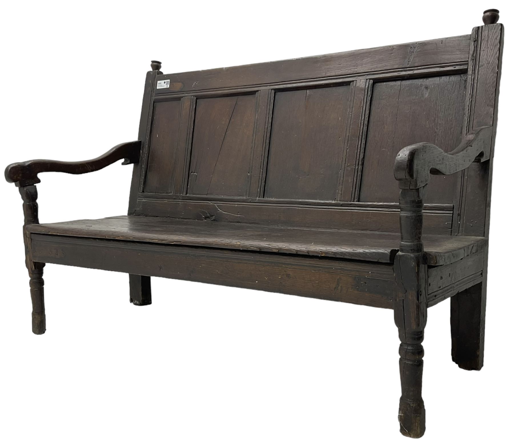 18th century oak hall bench or settle, quadruple panelled back with moulded rails, over a solid seat, raised on front turned supports