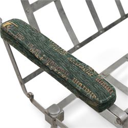 Victorian foldable day bed, button back padded arms, reupholstered in a green fabric with Latin script, turned feet with ceramic castors