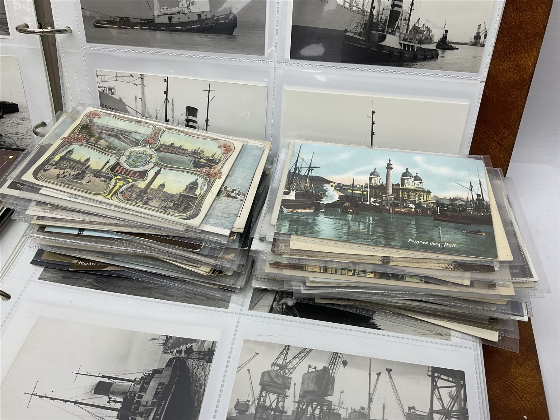 Collection of loose Edwardian and later postcards, mostly topographical examples depicting East Yorkshire, Hull and the East Coast, including Hull, Bridlington, Staithes, Flamborough Head, Beverley, etc., and a quantity of other postcards, plus two photograph albums containing photographs of trawlers
