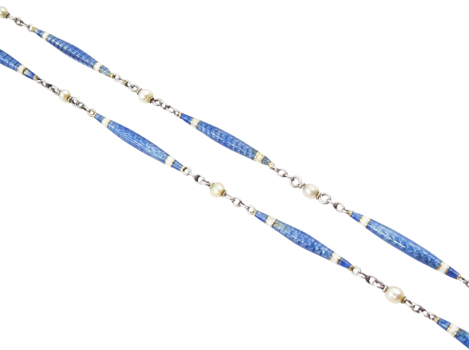 Early 20th century platinum enamel and pearl necklace, sixteen guillioche blue enamel and white enamel baton links, each spaced by a trace links and a single seed pearl
