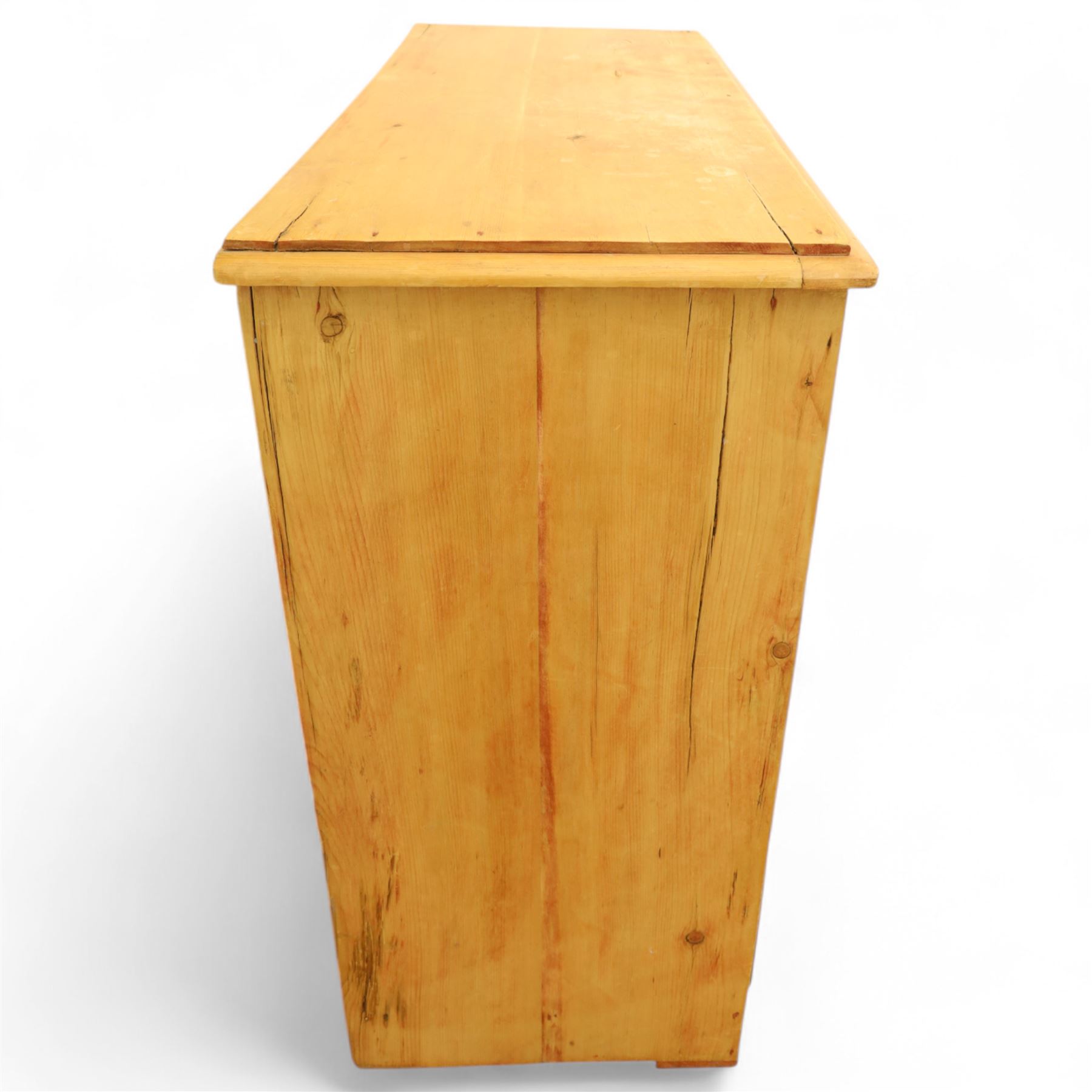 Victorian stripped pine chest, fitted with two short and three long drawers, turned wooden handles, shaped lower apron on bracket feet