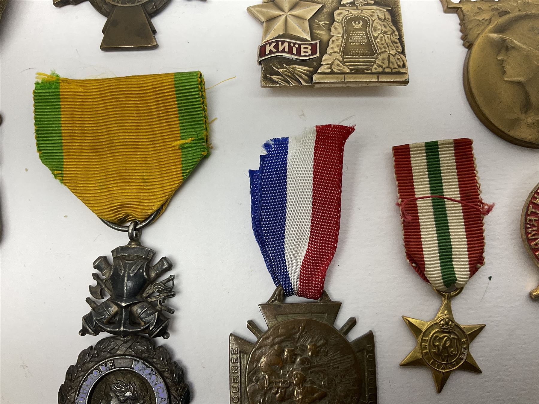 Five WW1 French medals comprising Medaille Militaire Gallantry Award, two Croix de Combattant, Medaille Commemorative Francais 1914-18 and a Patriotic Medal; together with small quantity of Russian badges etc