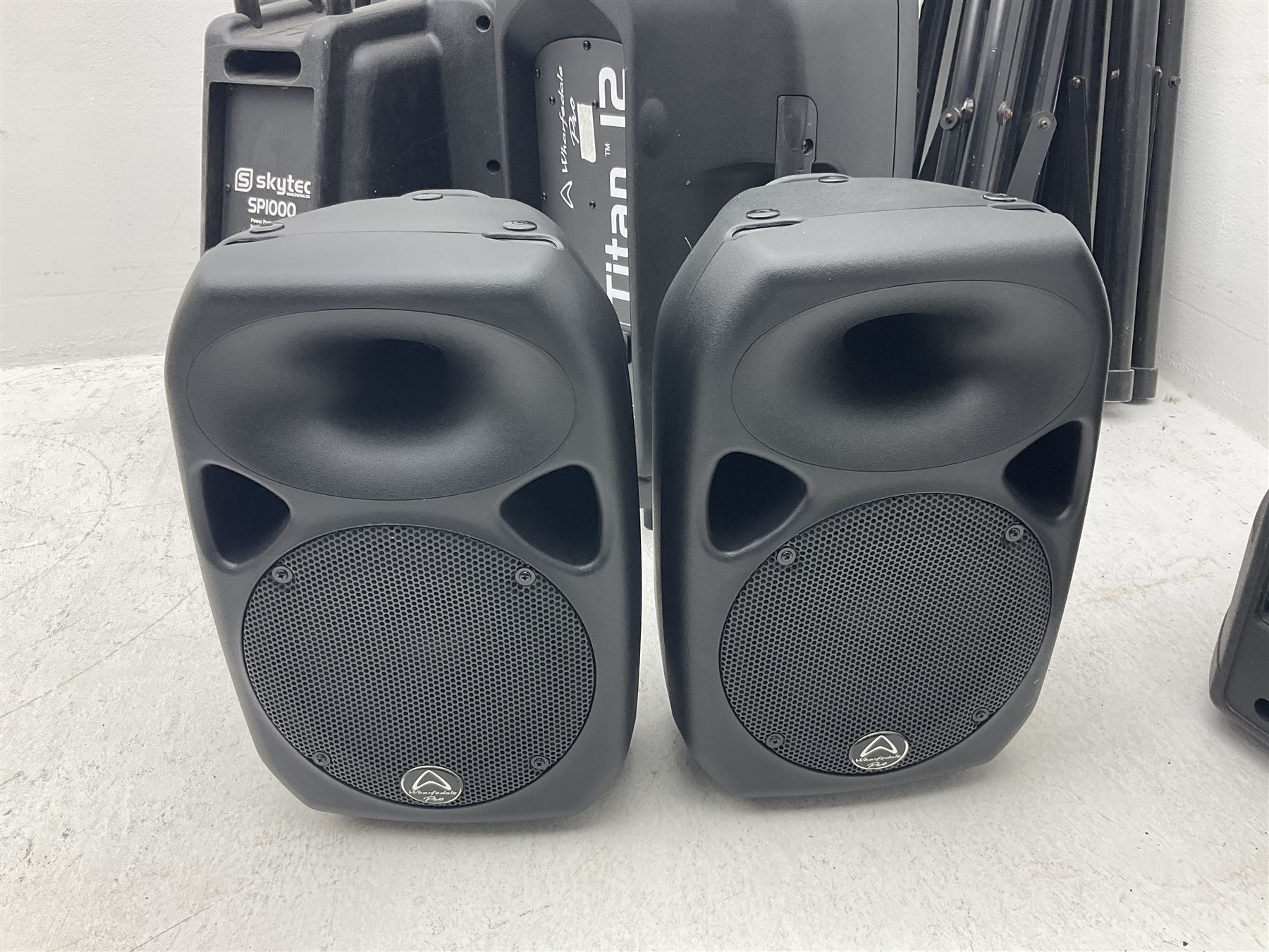 Wharfedale Pro Titan 12 speaker, pair of Wharfedale pro titan 8 speakers, Skytec SP1000 speaker, img stage line PAB-110 MK2 speaker and five speaker stands of various sizes (10)