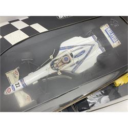 Three Minichamps 1:18 scale die-cast racing cars - Jordan Mugen Honda 198 D. Hill; Jordan Ford EJ13 G. Fisichella; and Stewart Ford SF 1 R. Barrichello; all boxed (3)