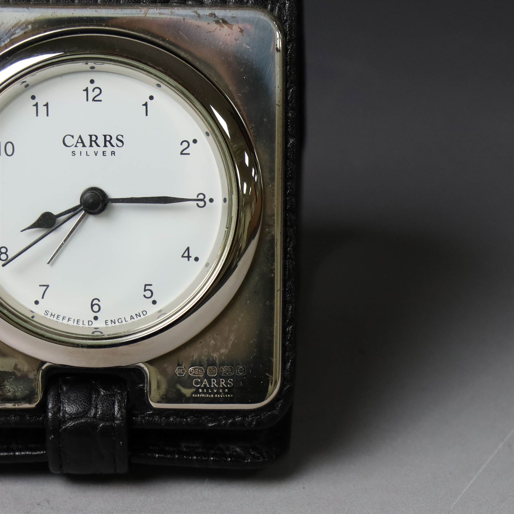 Silver mounted glass decanter, boxed with wooden plinth, together with a silver pepper grinder and a silver mounted Carrs desk clock, all hallmarked
