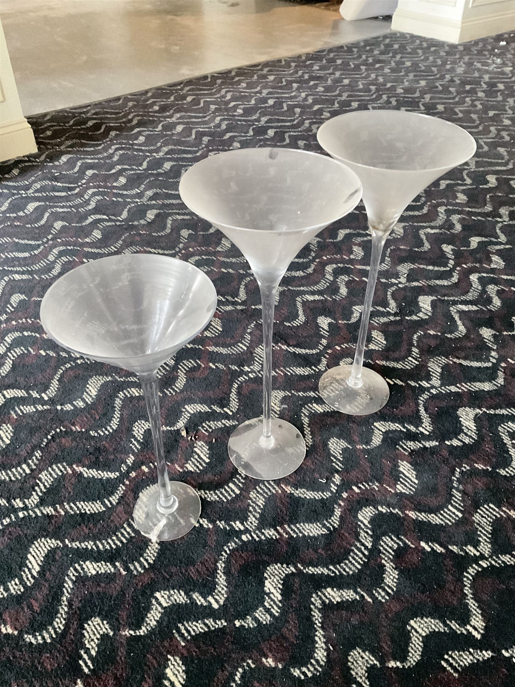 Three large glass ornamental wine flutes- LOT SUBJECT TO VAT ON THE HAMMER PRICE - To be collected by appointment from The Ambassador Hotel, 36-38 Esplanade, Scarborough YO11 2AY. ALL GOODS MUST BE REMOVED BY WEDNESDAY 15TH JUNE.