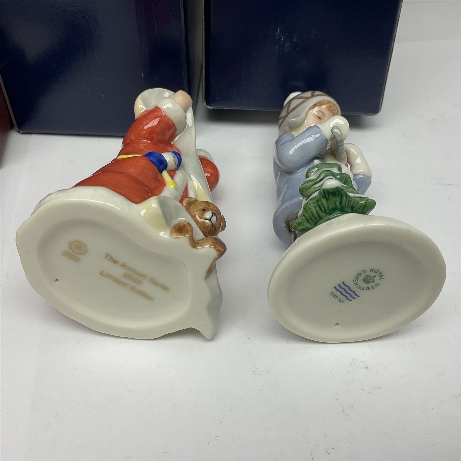 Two Royal Copenhagen figures, comprising Julie and Girl with Saw, together with Beswick Hunca Munca Sweeping, and two Villeroy & Boch christmas decorations, all with original boxes   