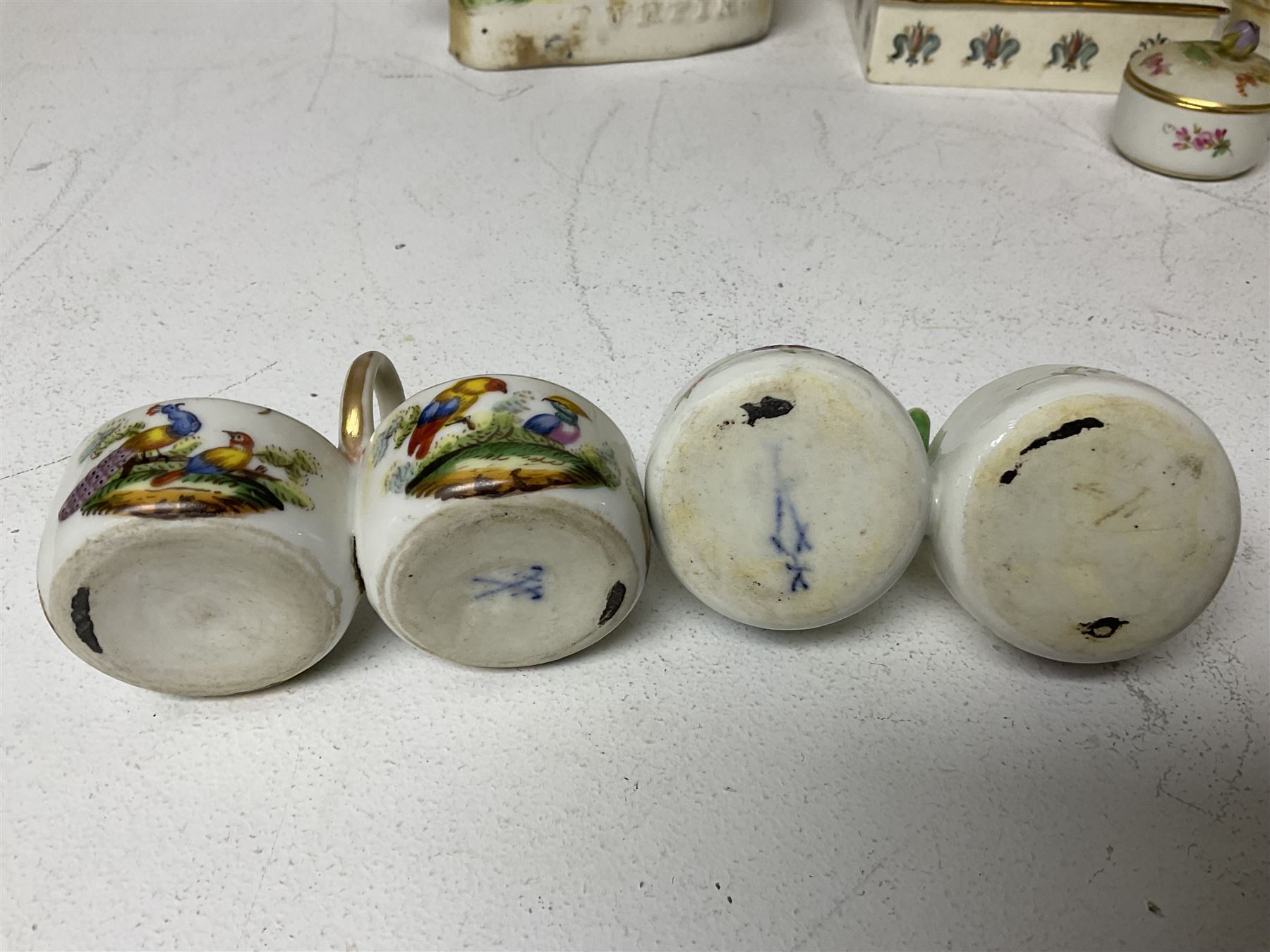 Staffordshire figure of the Duke of Wellington on a bay horse, H30cm in red uniform, together with a similar Staffordshire figure of Dick Turpin, pair of Staffordshire style dogs, H27cm, three Meissen style double salts and two trinket boxes 