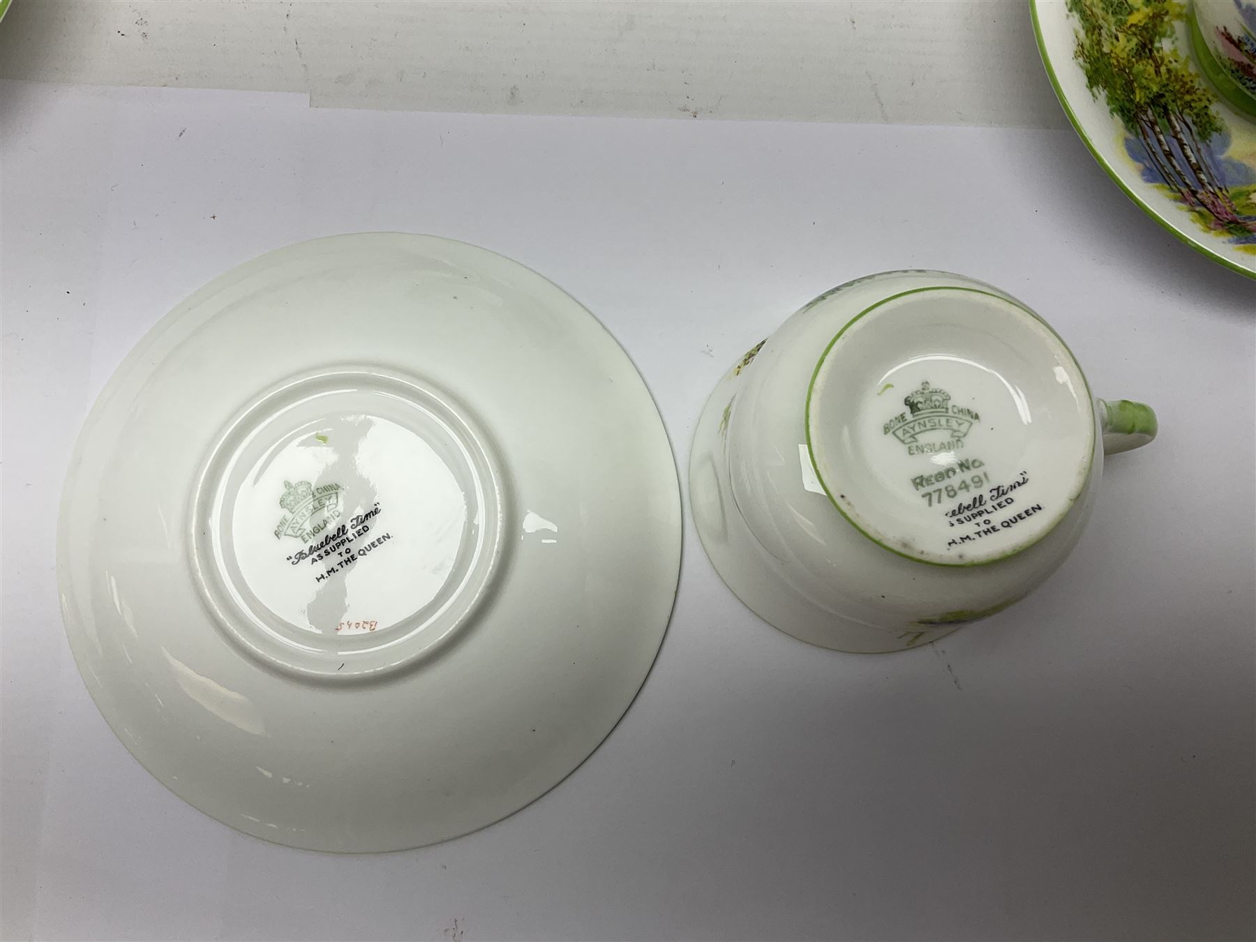 Aynsley Bluebell Time 'As Supplied to the Queen' tea service, comprising hot water jug, six teacups and saucers, milk jug, two cake plates and tow trinket dishes  