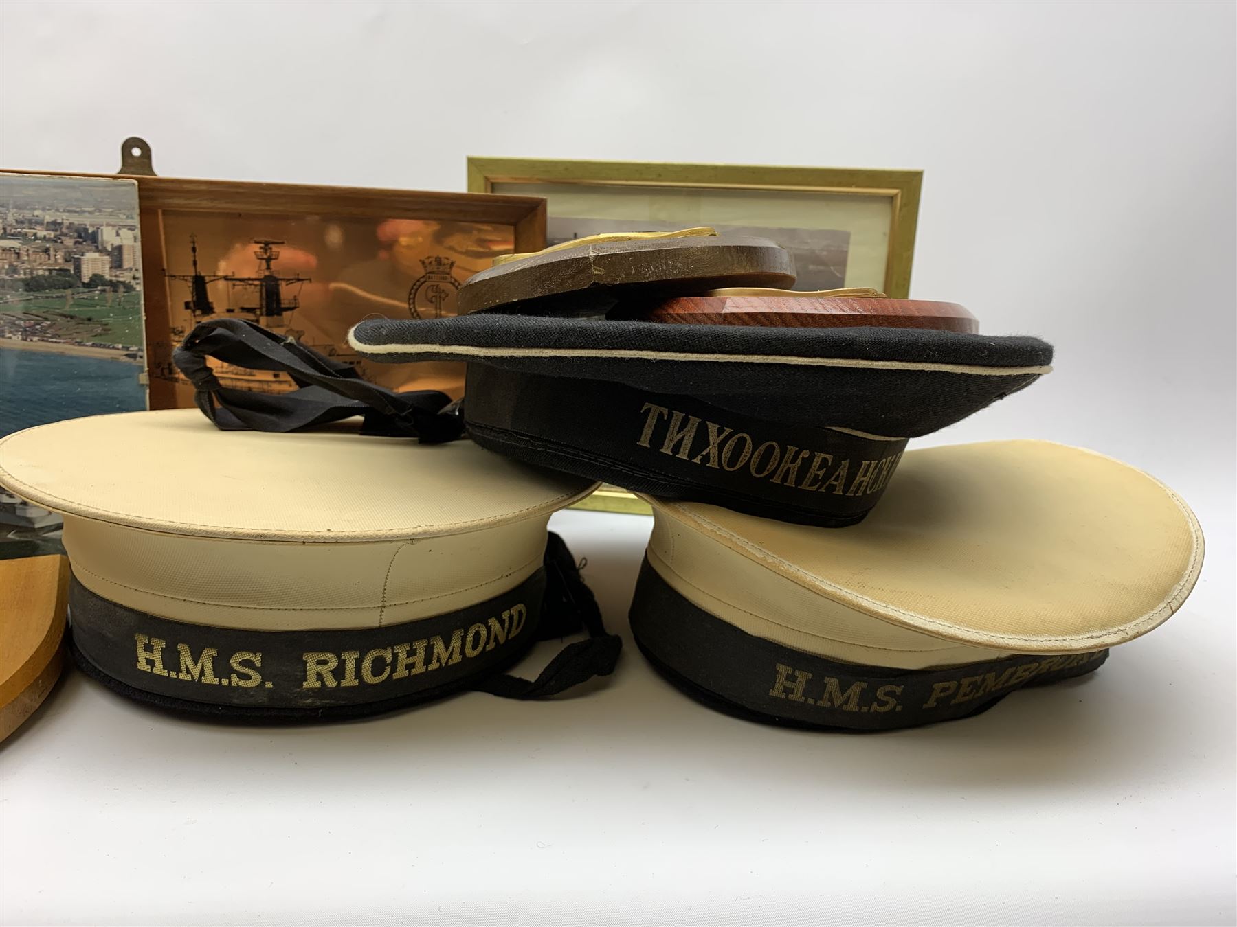Items of Maritime or Naval interest including two naval hats, one with 'H.M.S. Richmond' tally, the other with 'H.M.S. Pembroke' tally, framed prints etc