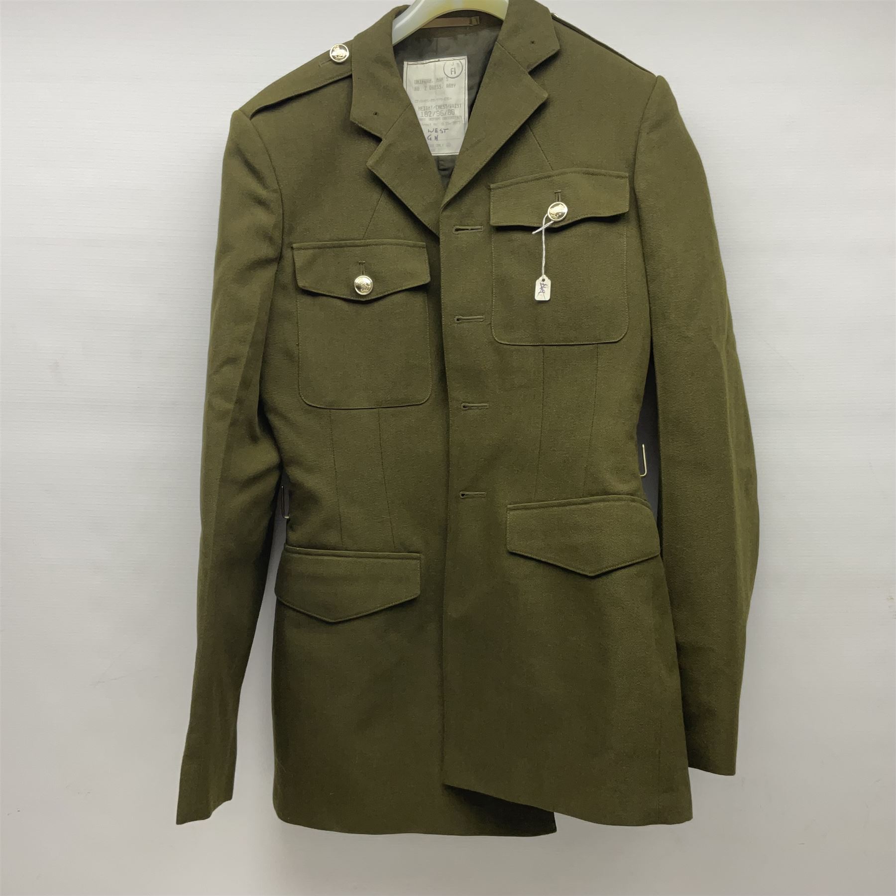 Two post-WWII British Army No.2 Dress tunics, one with Green Howards buttons; army shirt dated 1951; Royal Fleet Auxilliary jacket with trousers; three RAF/WAAF uniforms and RAF Greatcoat; and three canvas/webbing bags, two dated 1943 & 1945