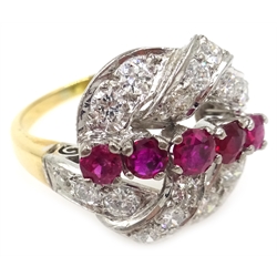  Ruby and diamond scroll ring, five graduating central rubies with diamond surround, unmarked  