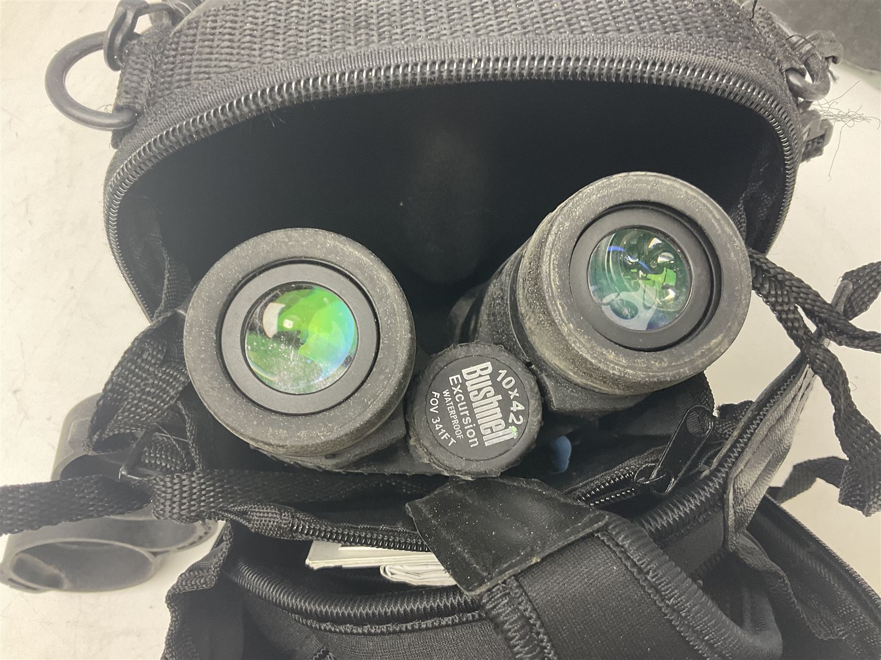 Yukon rubber armoured compact variable power spotting scope (boxed), together with Bresser 10x50 binoculars, Bushnell Excursion 10x42 binoculars, camera equipment etc  