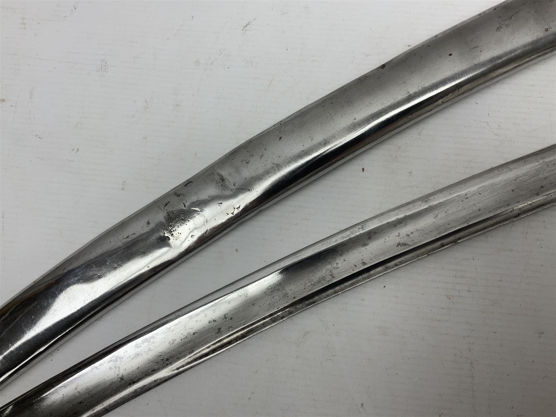 19th century French Chasseur a Cheval de la Guard trooper's sword with 86.5cm slightly curving fullered blade, brass three-bar hilt with elongated elliptical langets and wire-bound leather grip; in polished steel scabbard with two brass suspension rings L104cm overall
