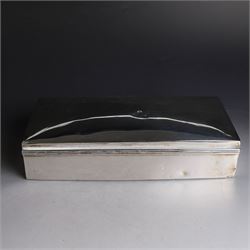 Two silver cigarette boxes, comprising early 20th century plain rectangular example with compartmentalised softwood interior, hallmarked Birmingham 1914, maker's mark indistinct, and an early 20th century example with engine turned decoration and engraved initials to cover, hallmarks worn and indistinct, largest H4.5cm, W21cm