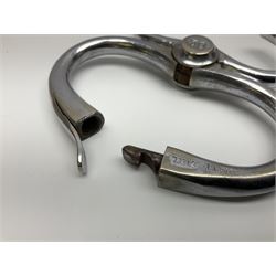 Police - two pairs of steel nipper handcuffs, one stamped Hull City Police; two other chromium plated Hiatt steel nipper handcuffs, each stamped HCP (?Hull City Police); and a pair of chromed steel articulated handcuffs stamped WRC (?West Riding Constabulary) (5)