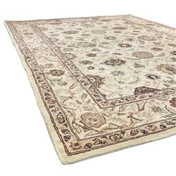 Gooch Carpets - Persian design ivory ground rug, trailing and interlacing design decorated with stylised plant motifs, within floral border and guard stripe 