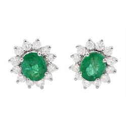 Pair of 18ct white gold oval cut emerald and round brilliant cut diamond stud earrings, stamped, total emerald weight approx 1.35 carat, total diamond weight approx 0.65 carat